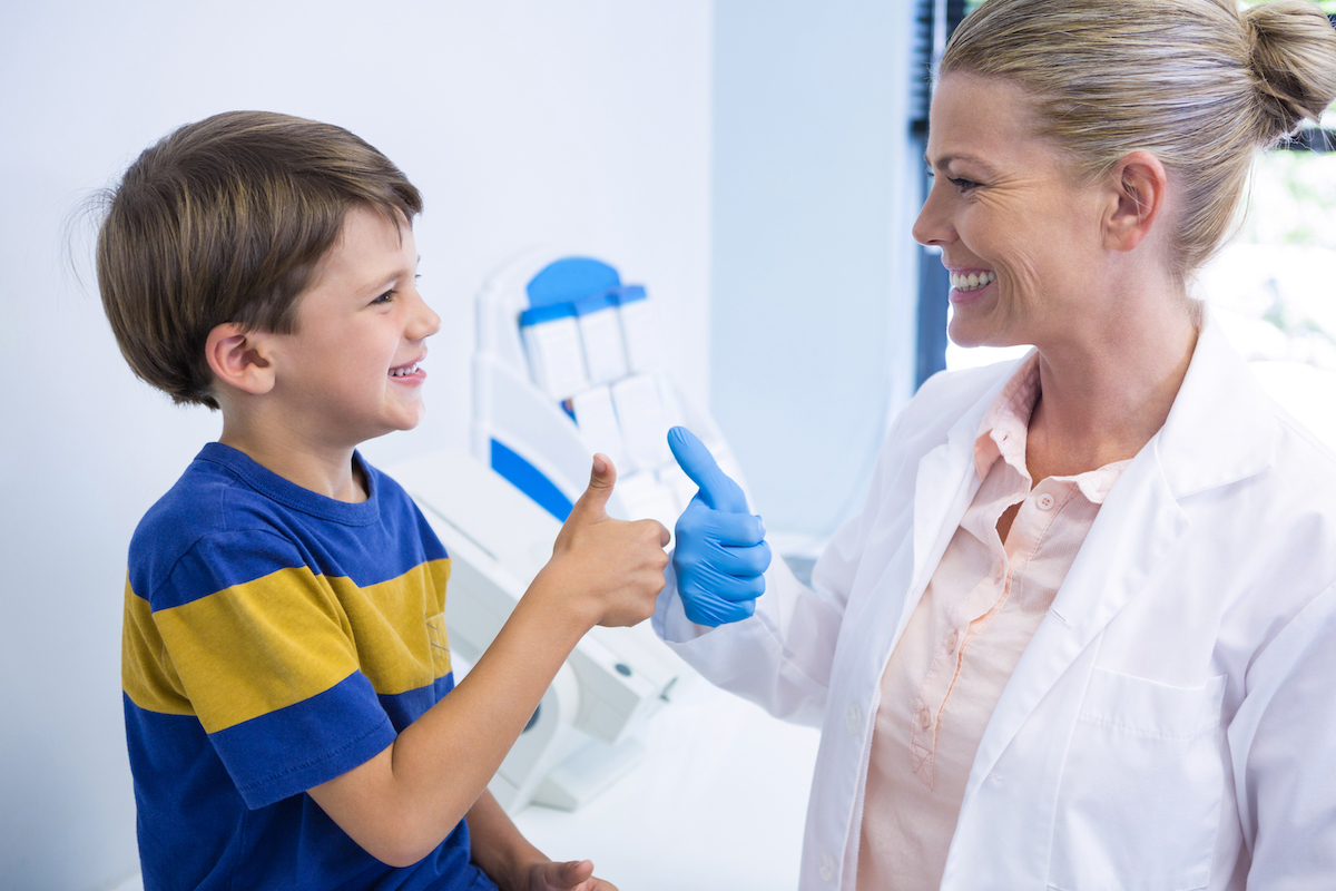 dr-schweppe-pediatric-dentistry-preventative-care pediatric dentist giving child thumbs up